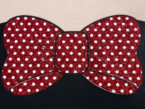 A close up of a bow made with Red GlitterFlex® Ultra Perf