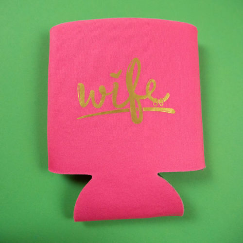 A hot pink koozy with the word "wife" in Gold ThermoFlex® Turbo Brights