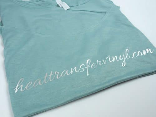 A shirt made with Pearl White DecoFilm® Paint FX with a scripty font that reads "Heattransfervinyl.com"