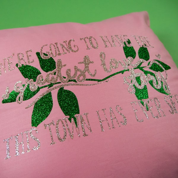 A pillow made using GlitterFlex® Ultra and our "Greatest Love Story" cut file.