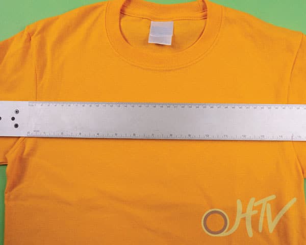 Measuring the shirt before cutting your HTV to make sure it's not too big or too small!