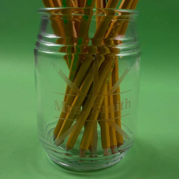 A jar filled with pencils with an teacher's name and pencil design in Red Etched SpecialtyPSV™