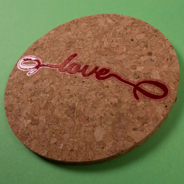 The word "Love" on a coaster in Red and Silver Pink Transparent Glitter SpecialtyPSV™