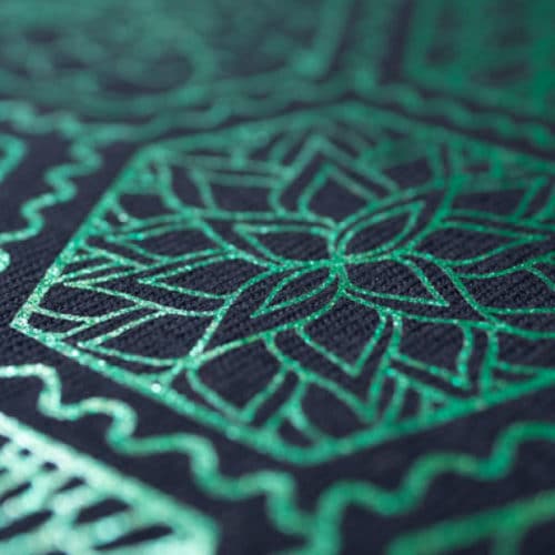 A close up of a very detailed shirt made in Green PearlFlex™
