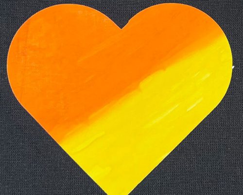 A heart cut out of ThermoFlex® Color Up and painted with an orange to yellow gradient